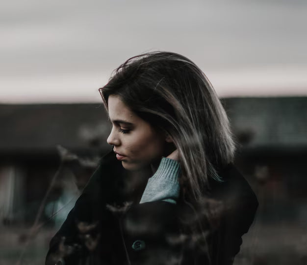 files/close-up-young-woman-standing-against-sky_1048944-24280269.avif